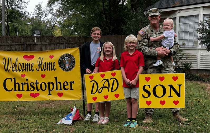 Dr. Christopher Hooper in Louisiana Army National Guard uniform with his family