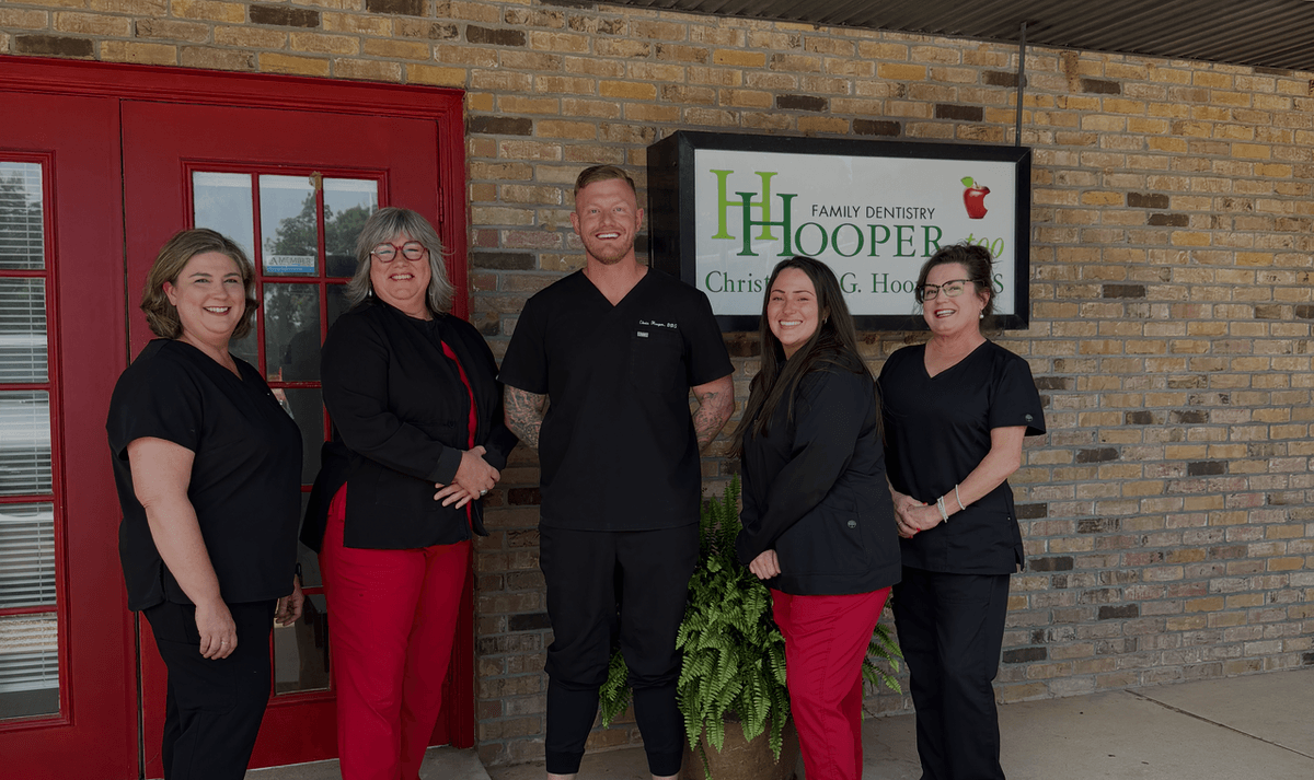 Dr. Christopher Hooper with the Hooper, Too dental team
