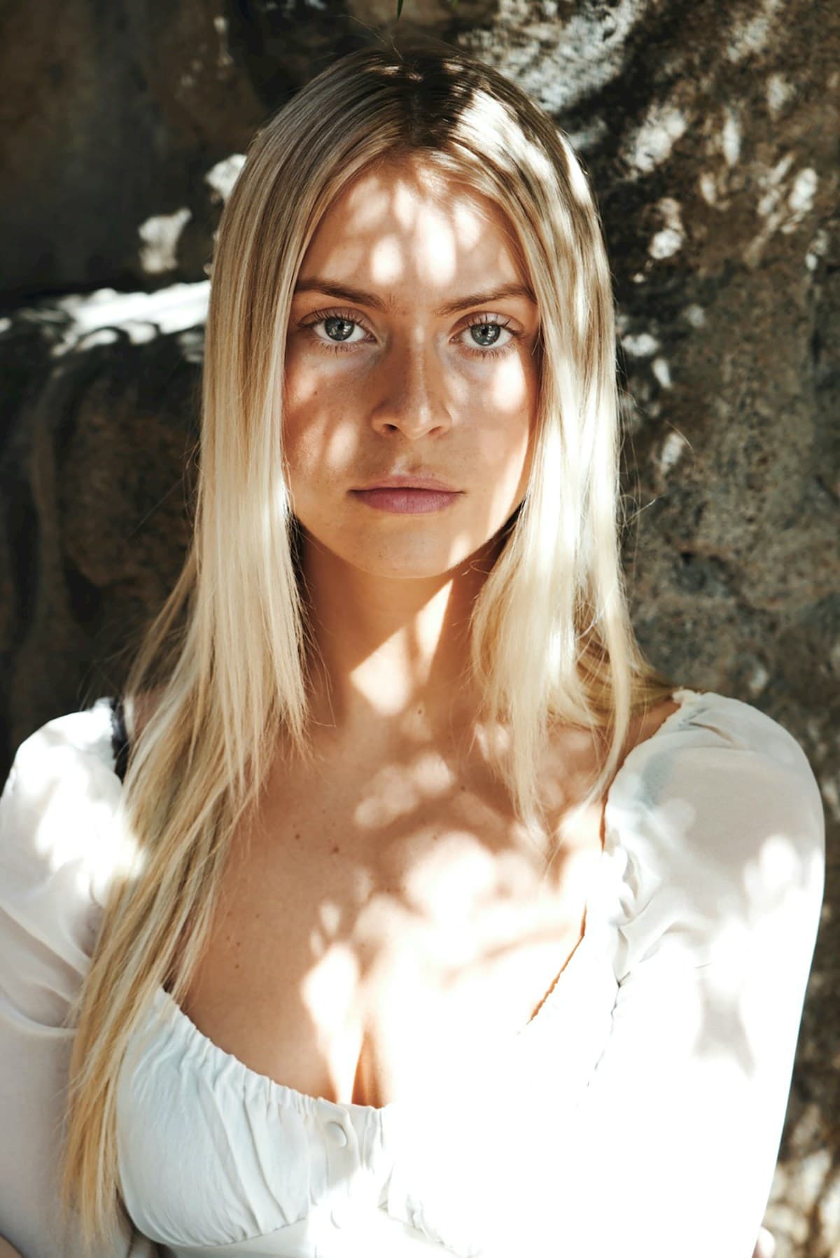 Woman in white shirt smiling